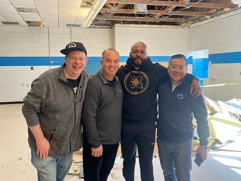 The GENERATION crew pose with Bethea as early construction gets underway. Credit: GENERATION